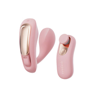 Pink and gold vibrator on a white background